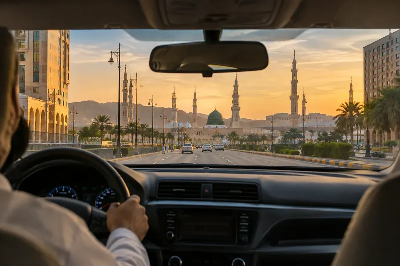 Taxi ride from Madinah airport arriving near Masjid an Nabawi at sunset