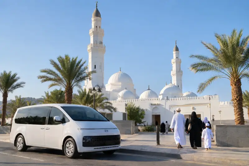 Madinah ziyarat taxi parked outside Masjid Quba